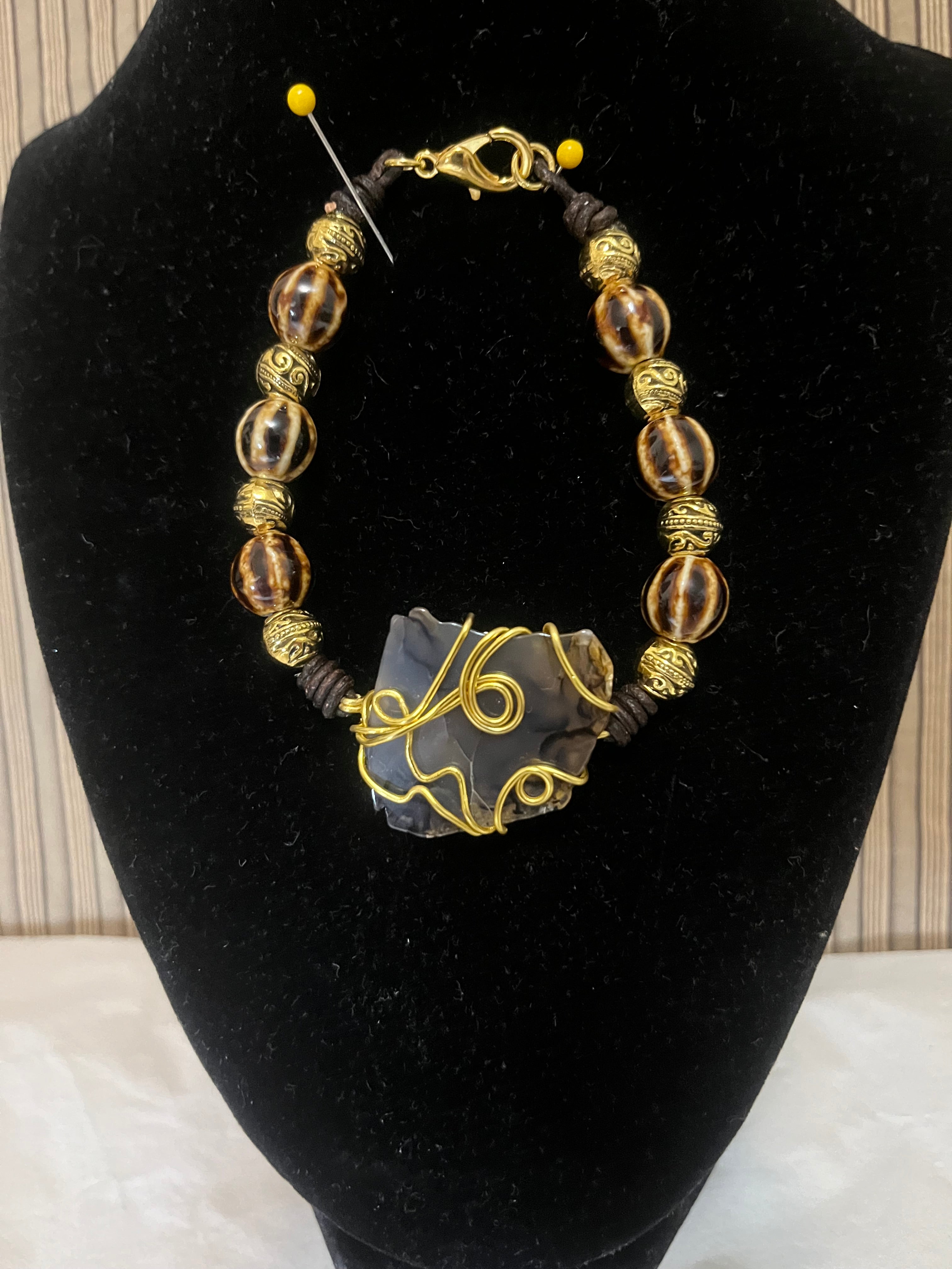 Bracelet Ceramic brown tones beads, Metal, Wire wrapped stone in the center as a focal point