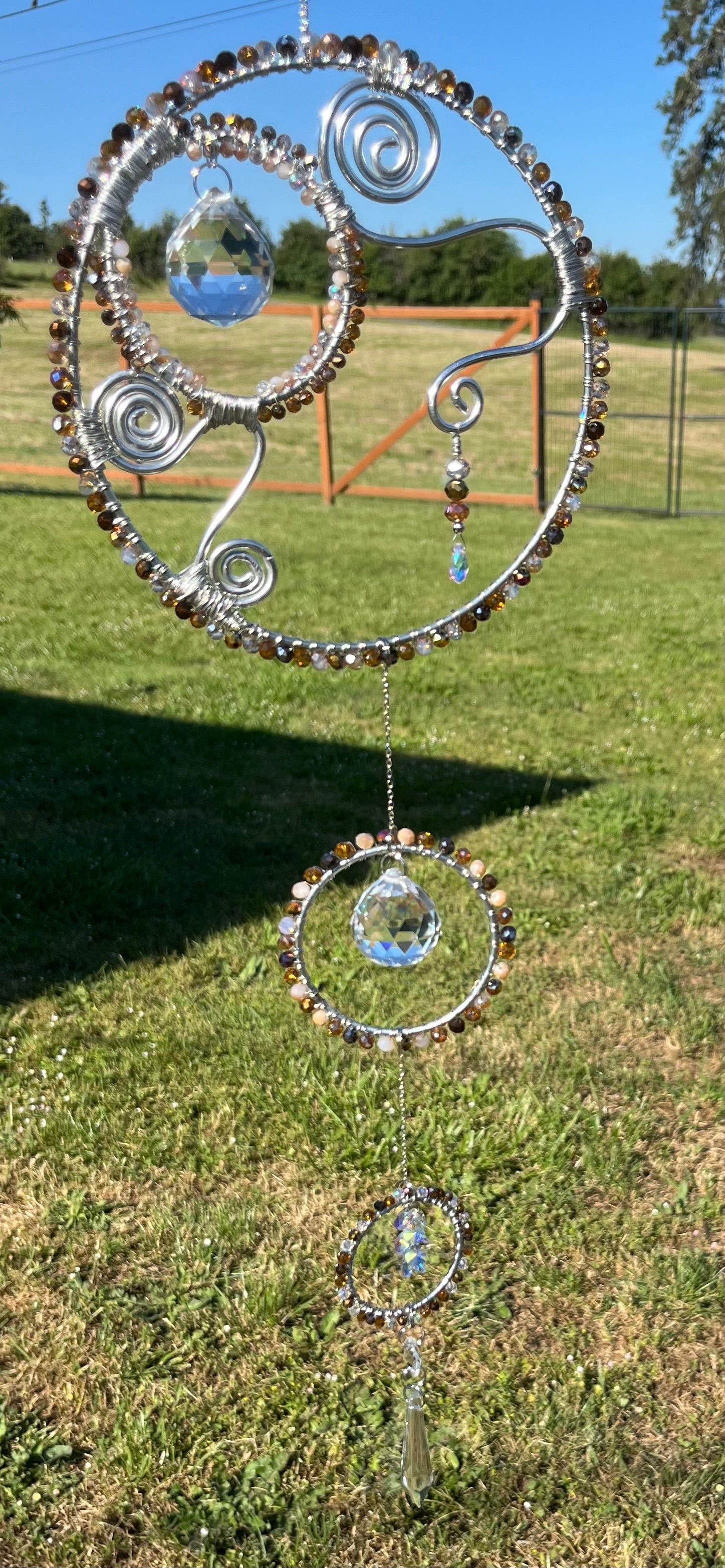 Suncatcher with 4 circles, 3 crystal prisms & pendulum, and some crystal  dangles